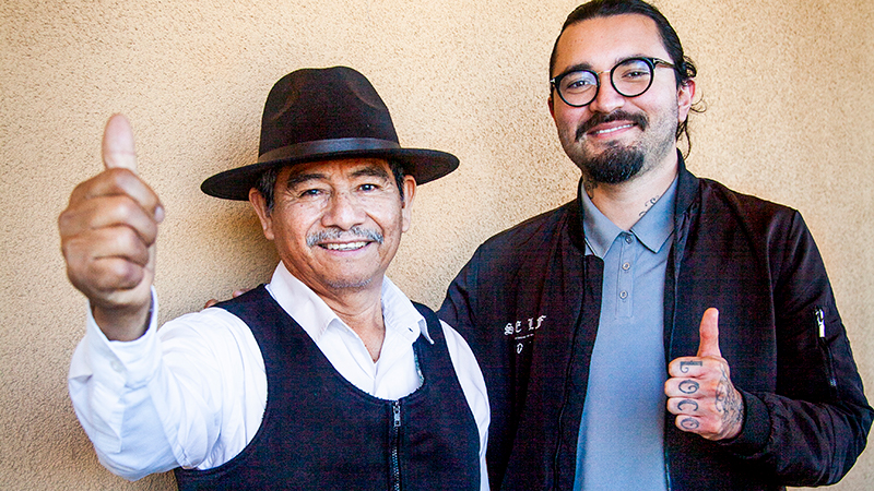 Photo of two men giving a thumbs up